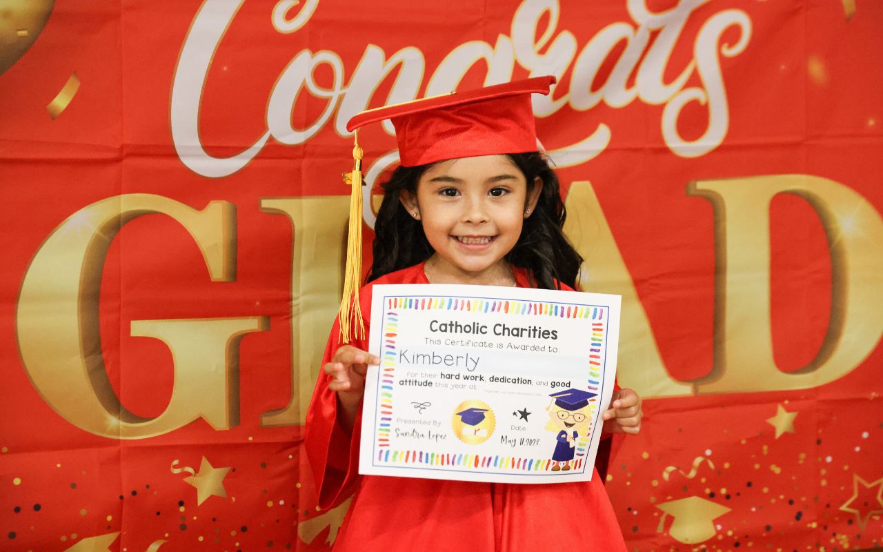 TWL Photo Edited girl holding certificate of completion