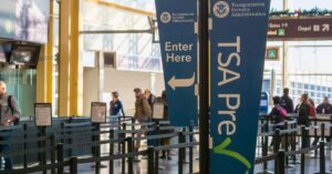 TSA lines at an airport during the day, not very busy