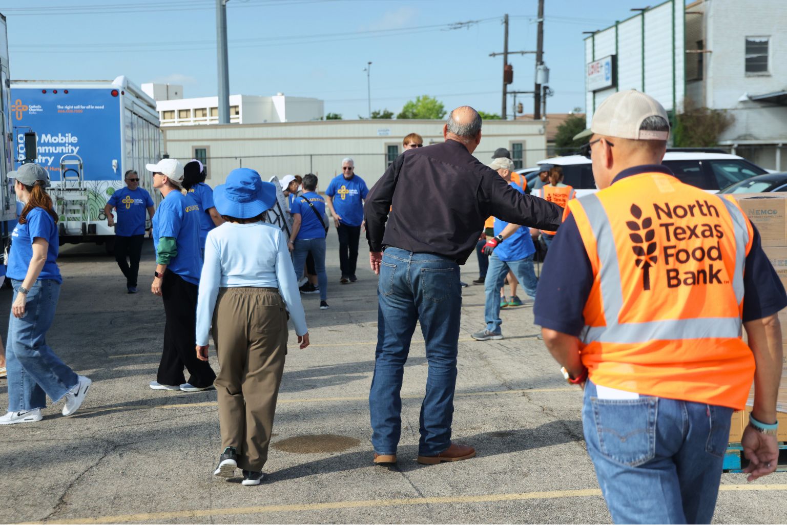group of people unloading food truck at mobile distribution